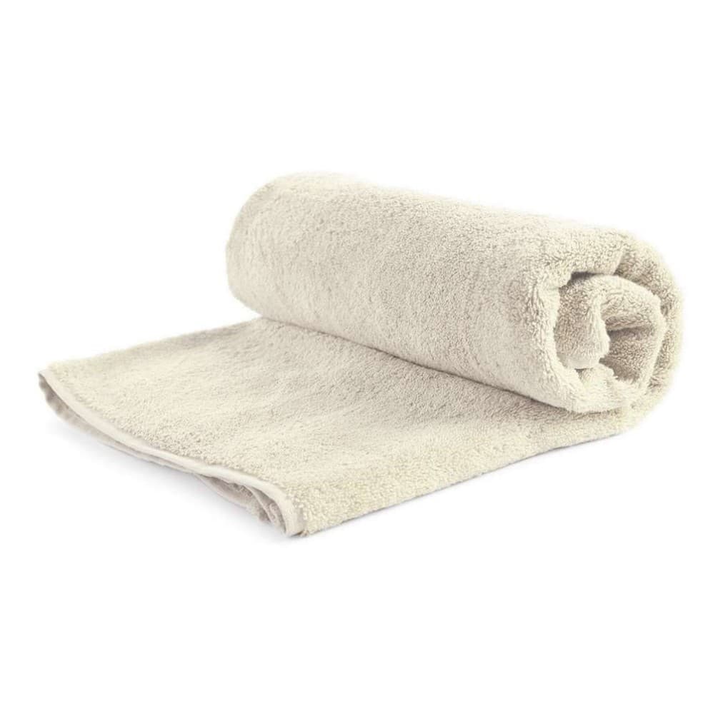 Rolled natural-colour Urtica towel showing terry texture and compact form.